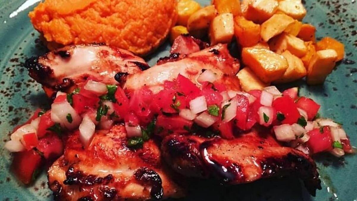 Primal Gourmet’s honey key lime charred boneless chicken thighs with fresh pico, maple whipped sweet potatoes, tangy coconut roasted parsnips and golden beets.