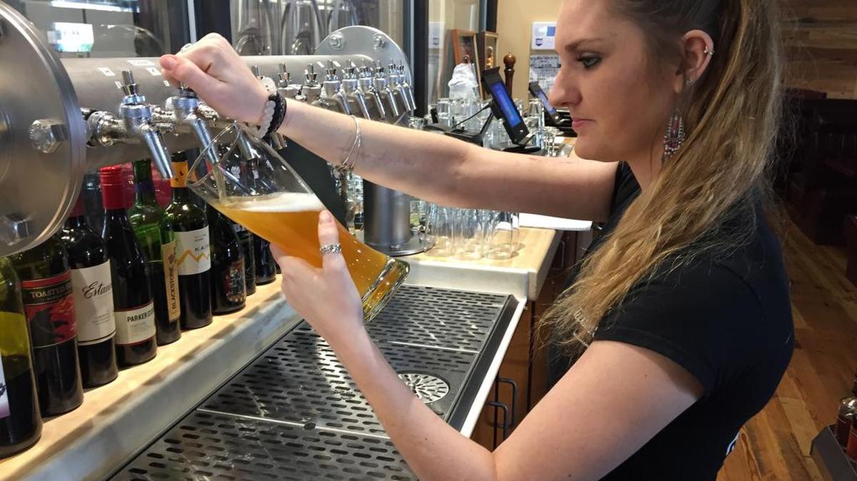 Beer being poured at Twisted Spur Brewing, which opened this weekend in the Vista.