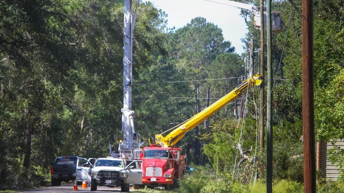 Power crews work to restore electricity Monday on Clarendon Road near Seabrook in Beaufort County.