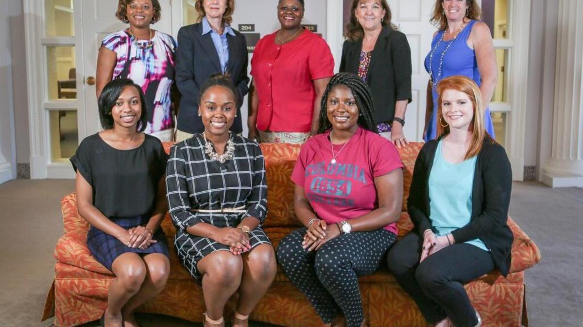 All students at Columbia College participate in a mentorship program where students are matched with adults in the professional world. Students, front row from left, Brianna Gamble, Cierra Bowers, Kenyatta Gilchrist and Lainey Wood work with mentors and staff, back row, from left, Chante Clarkson, Nancy Koons, Bernadette Hampton, Mary Beard and Christine LaCola.