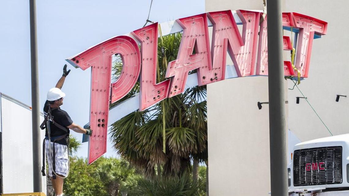 
The sign on Planet Hollywood is removed on Tuesday, the day after the local restaurant closed.
