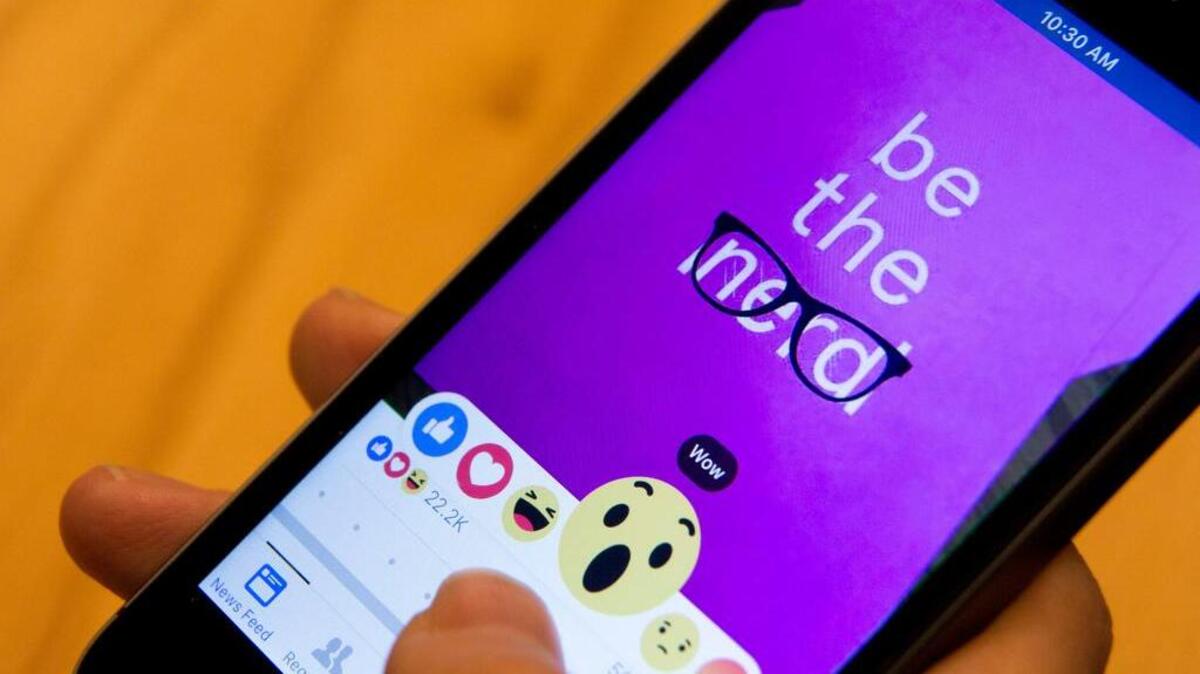 Julie Zhuo, product design director at Facebook, demonstrates the new emoji-like stickers customers will be able to press in addition to the like button. Facebook's Like button is getting some company, as the company rolls out alternatives worldwide after testing in a few countries.