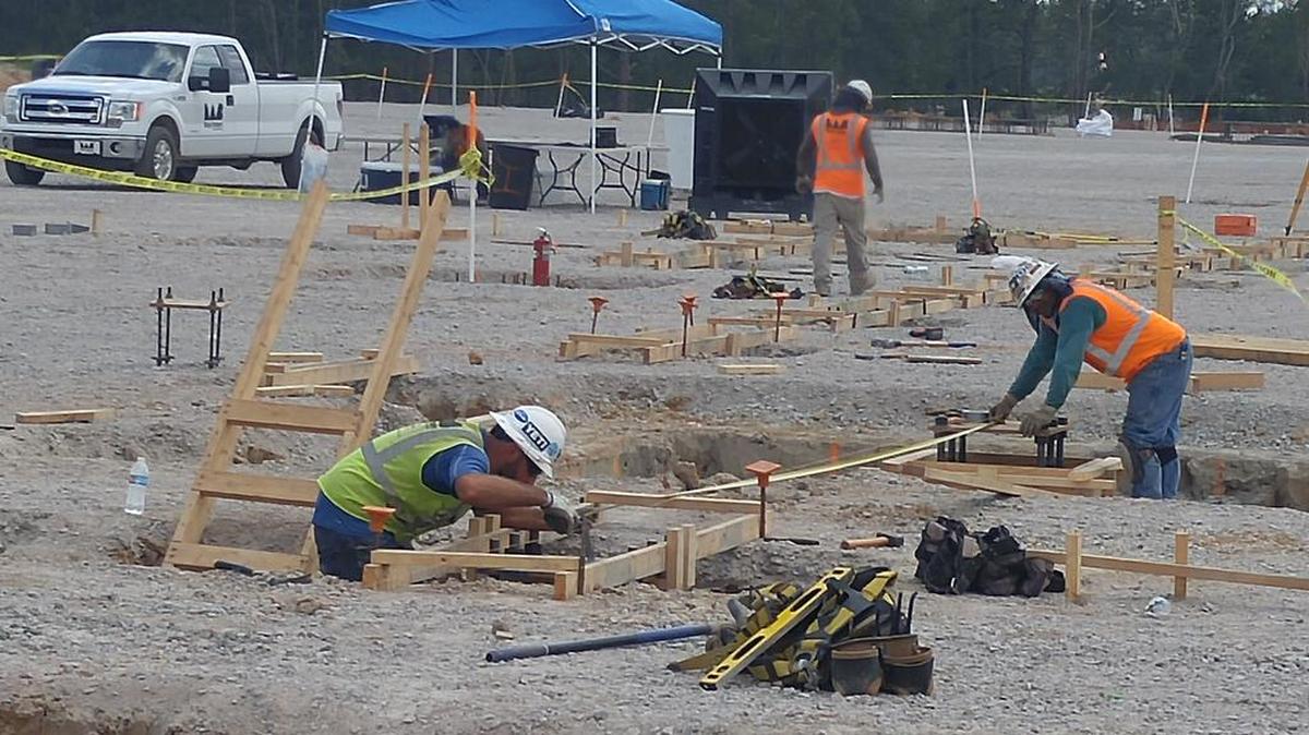 Construction workers install foundations at the planned $300 million Jushi fiberglass plant in Richland County’s Pineview Industrial Park.