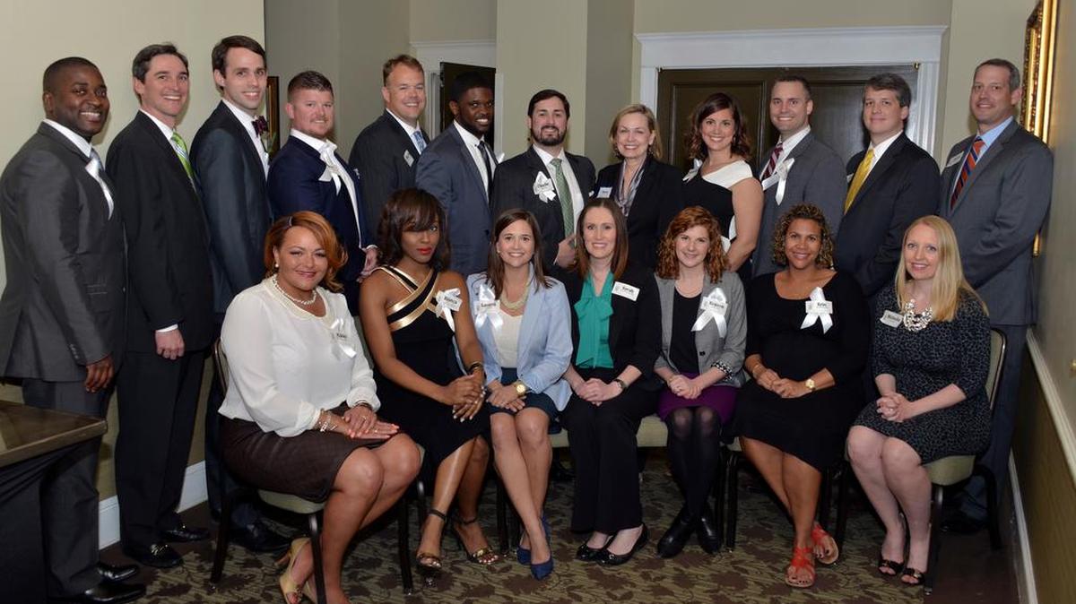 Members of The State's 20 under 40 class of 2016 receive their awards at an award banquet at the Capital City Club in Columbia. They are joined by The State’s publisher and president, Sara Borton.