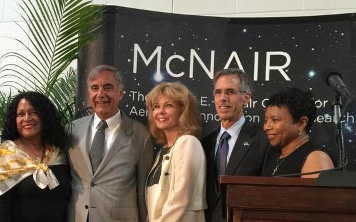 
USC leaders and supporters, including USC President Harris Pastides, fifth from left, who is flanked by graduate and donor Darla Moore on the right and Cheryl McNair, widow of S.C. native and former NASA astronaut Ronald McNair on his left, join Boeing chief technology officer, John Tracy to herald a $5.5 million aerospace research agreement to improve Boeing products. 
