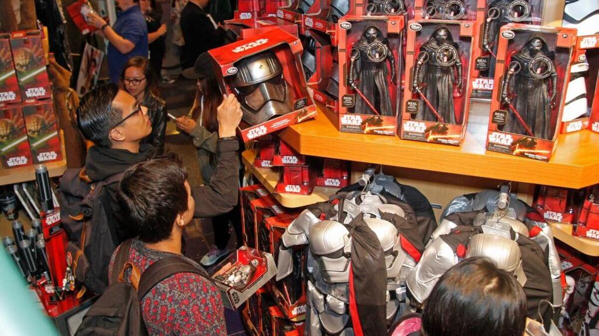 
Fans enjoy midnight madness as Force Friday kicks off at Disney Store Stockton Street in San Francisco. 
