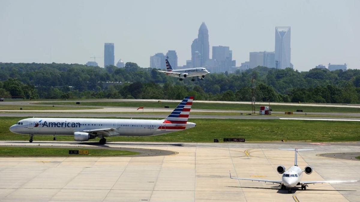 
A view from atop the new Hourly Deck and Consolidated Rental Car Facility at Charlotte Douglas International Airport as airplanes land and prepare to take off, on Monday, May 4, 2015. 
