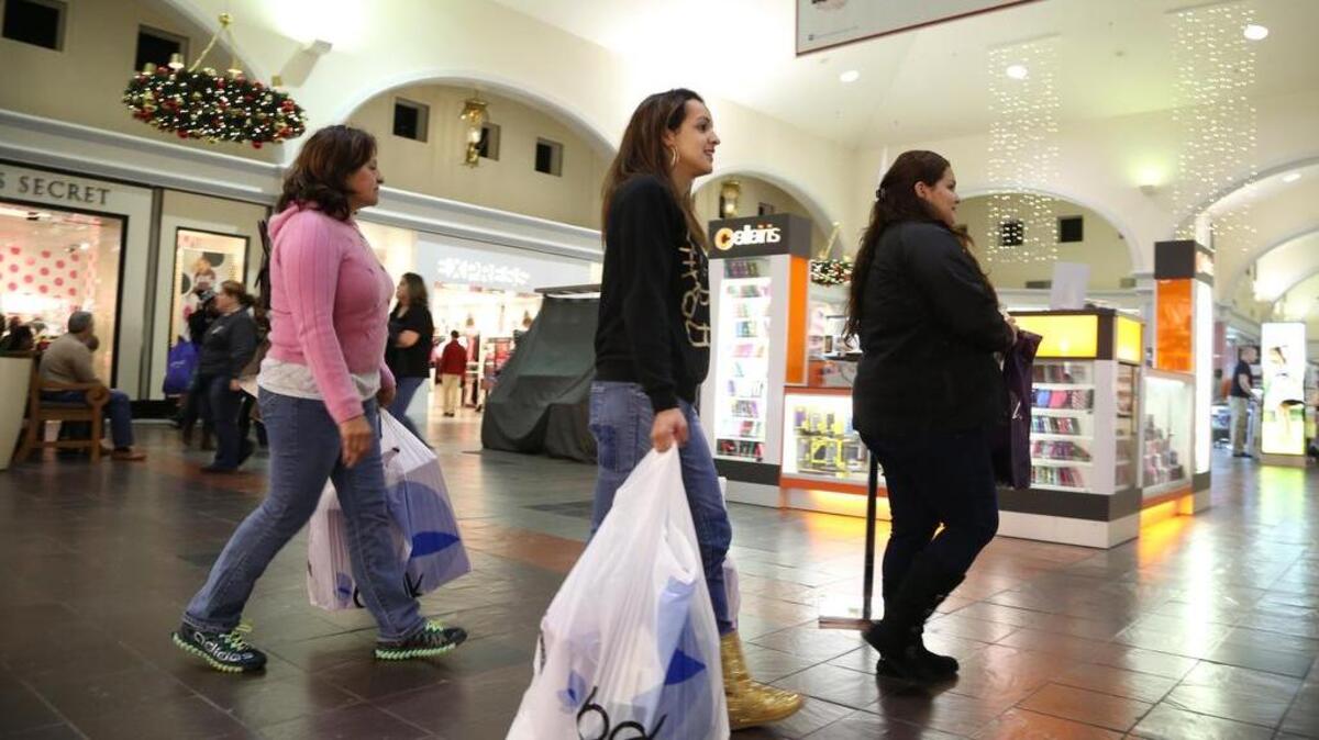 Customers shop at Columbiana Centre on Thanksgiving night in 2014.