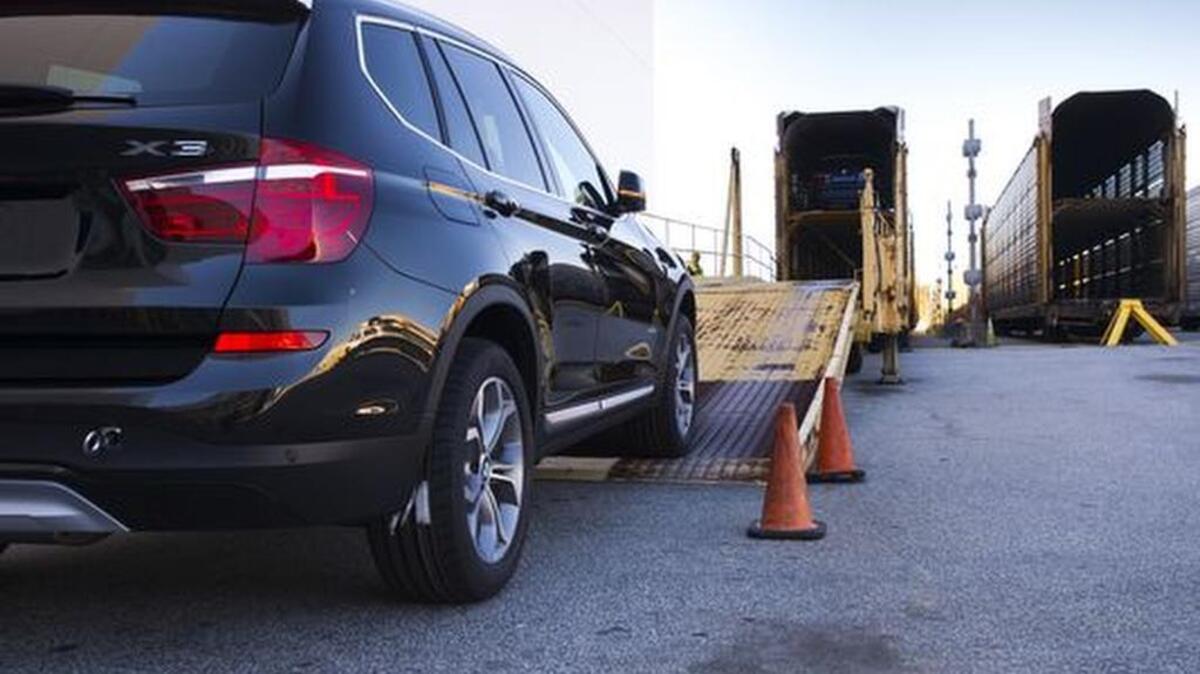 BMW X3 and X4 models are placed on train cars for shipping at the BMW Manufacturing plant in Greer on Tuesday, October 20, 2015.