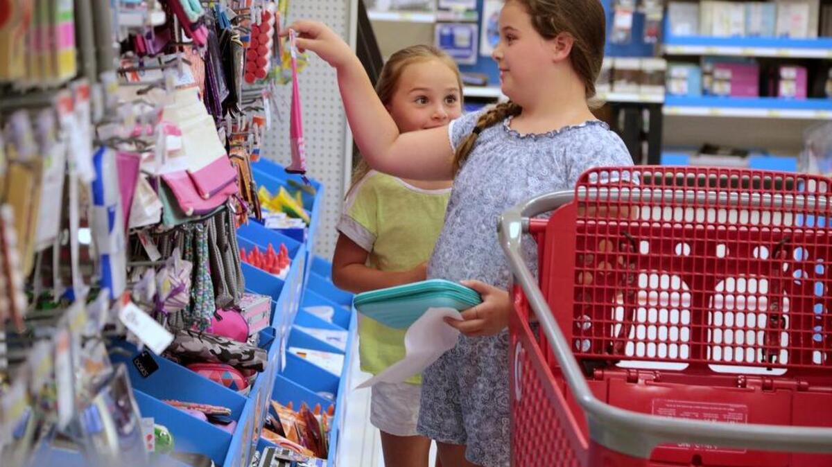 Rosie and Eliza Davis shop for their school supplies at Target on Garners Ferry Road on Thursday. With the state's tax holiday slated for this weekend, back-to-school sales are already in full swing