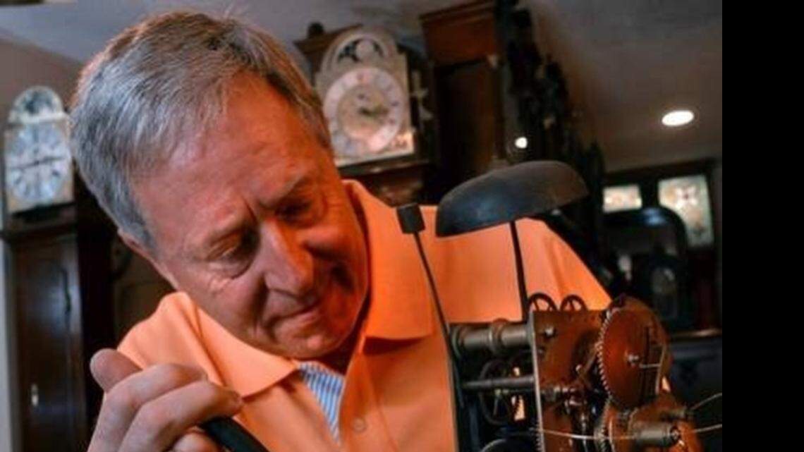 
Randy Cobb has a collection of more the 25 antique, grandfather clocks at his home in . Cobb runs Legacy Antique Clocks, and buys, repairs, and sells many of the vintage collector's clocks. Cobb repairs the clockwork for a vintage clock.
