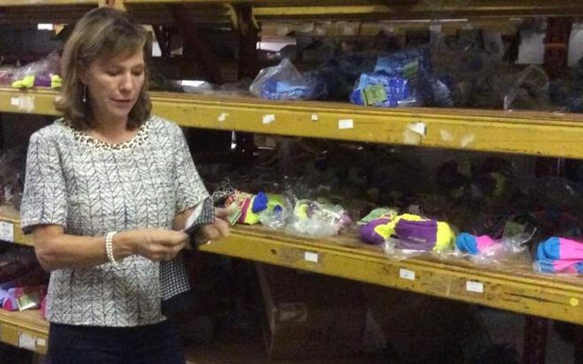 
Joanna Godwin examines some of her merchandise.
