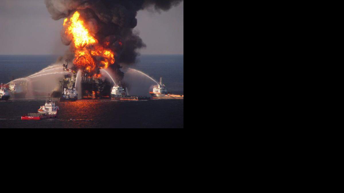 Fire boat response crews spray water on the burning BP Deepwater Horizon offshore oil rig in April 2010.