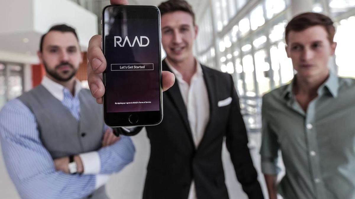 Kory Keefer, Wilson White and Jacob Wisneiwski developers of RAAD, an application that allows bar-goers to pay to jump lines utilize the Watt Innovation Center in Clemson to perfect their product.