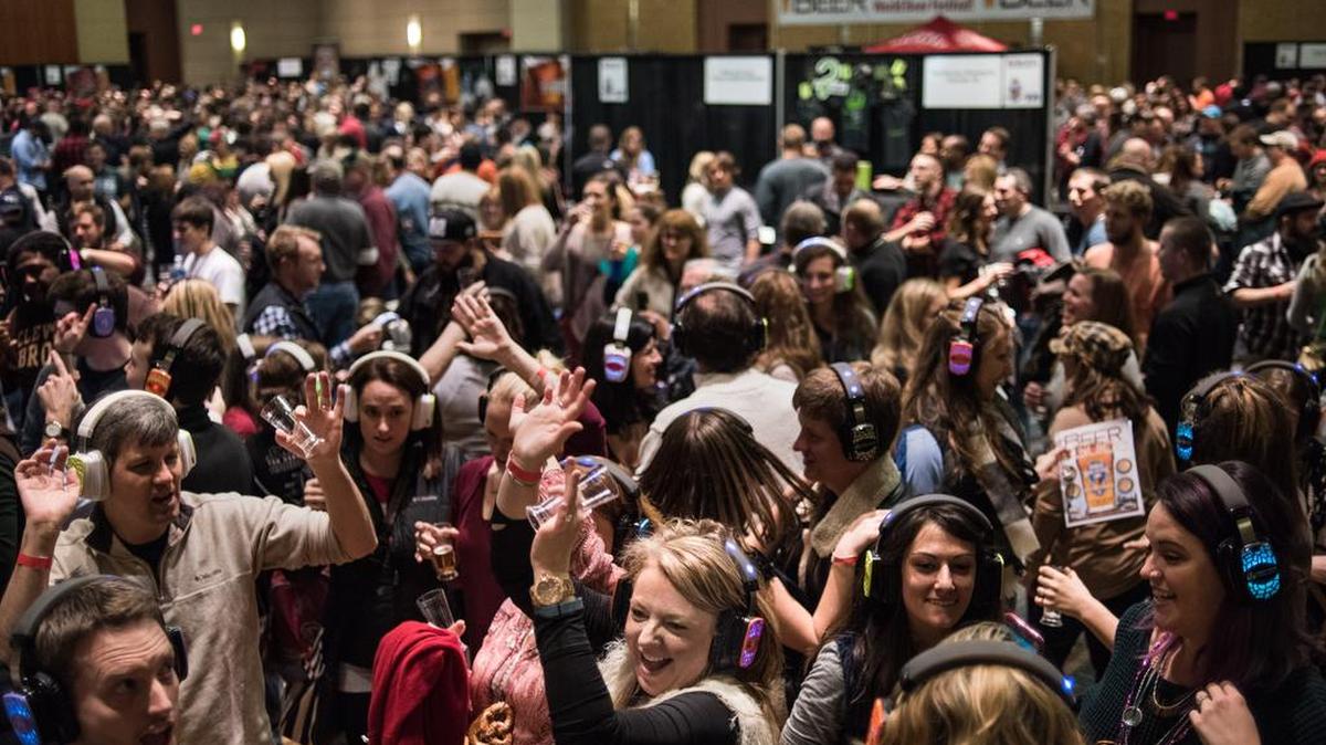 Revelers dance on the silent dance floor at the World Beer Festival in January at the Columbia Metropolitan Convention Center.