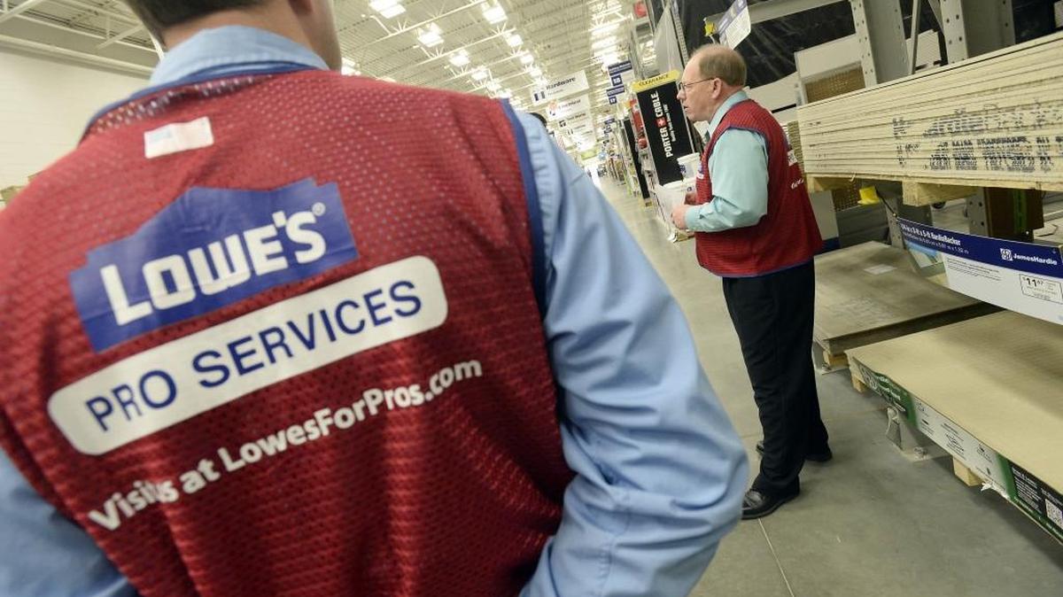 Lowe's Vice-President for Pro Services Mike Horn (right) talks about the store's new Pro Services initiative while at the Perimeter Parkway store on March 5, 2014.