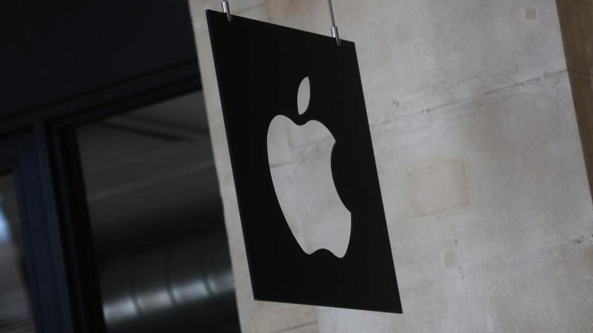 A logo sits on a sign hanging outside Apple Inc.’s Covent Garden store in London, U.K.