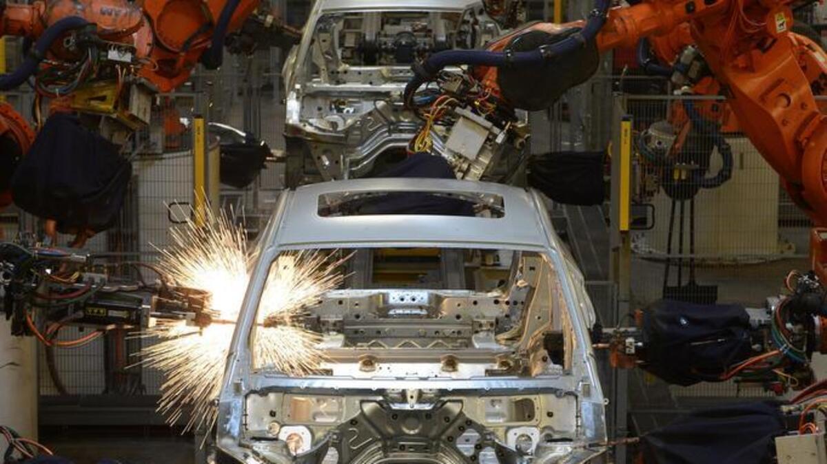 Robots weld on the frames along the assembly line at the BMW plant in Greer.