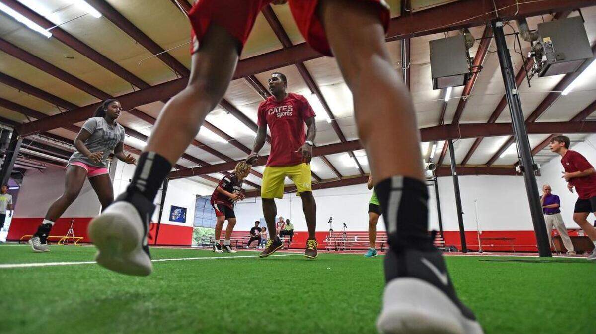 Former USC wide receiver Toby Cates works with kids at his training facility Cates Sports in Greer.
