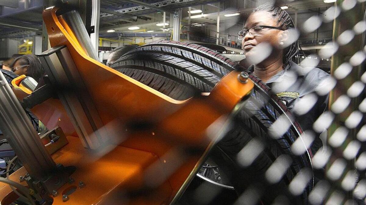 An inspector examines a tire following the grand opening of Continental Tire’s Sumter plant in 2014. The plant is already being expanded.