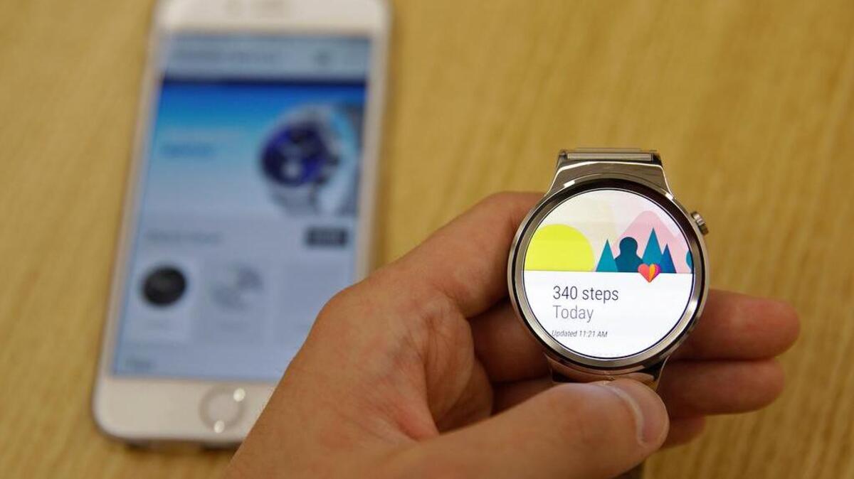 
In this Aug. 21, 2015, a new Android Wear smartwatch that is compatible with the Apple iPhone is displayed at Google's offices in San Francisco. Google is introducing an application that will connect Android smartwatches with Apple's iPhone, escalating the rivals' battle to strap their technology on people's wrists. (AP Photo/Eric Risberg)
