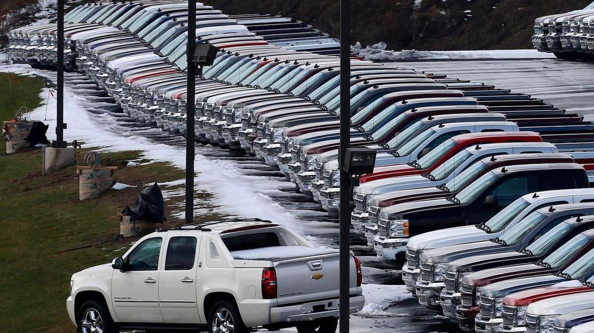 Chevy trucks line the lot of a dealer in Murrysville, Pa., in 2013. U.S. consumers bought a record number of cars and trucks in 2016.