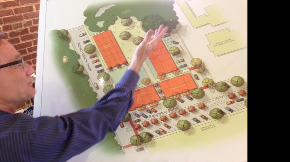 
Fred Delk and the site plan for the future Stormwater Studios.
