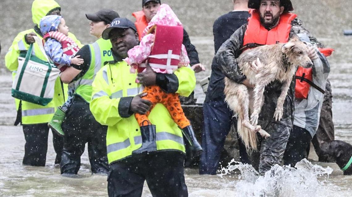 Residents on Woodlake Drive in Forest Acres woke up with their homes submerged in flood water. Columbia police officers helped them to safety.