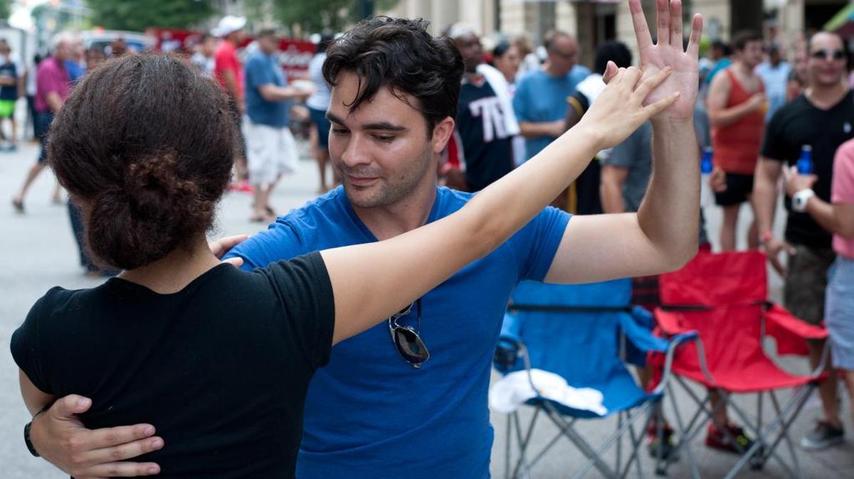 
Michael Peralta of Columbia dances with Nina Rivers of Charleston Saturday at the Main Street Latin Festival in downtown Columbia. 
