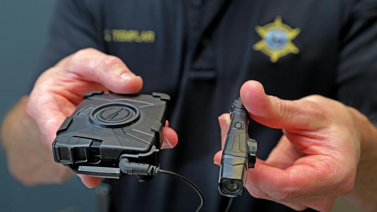Kershaw County Lt. Danny Templar displays the Taser Axon Flex Body police camera.