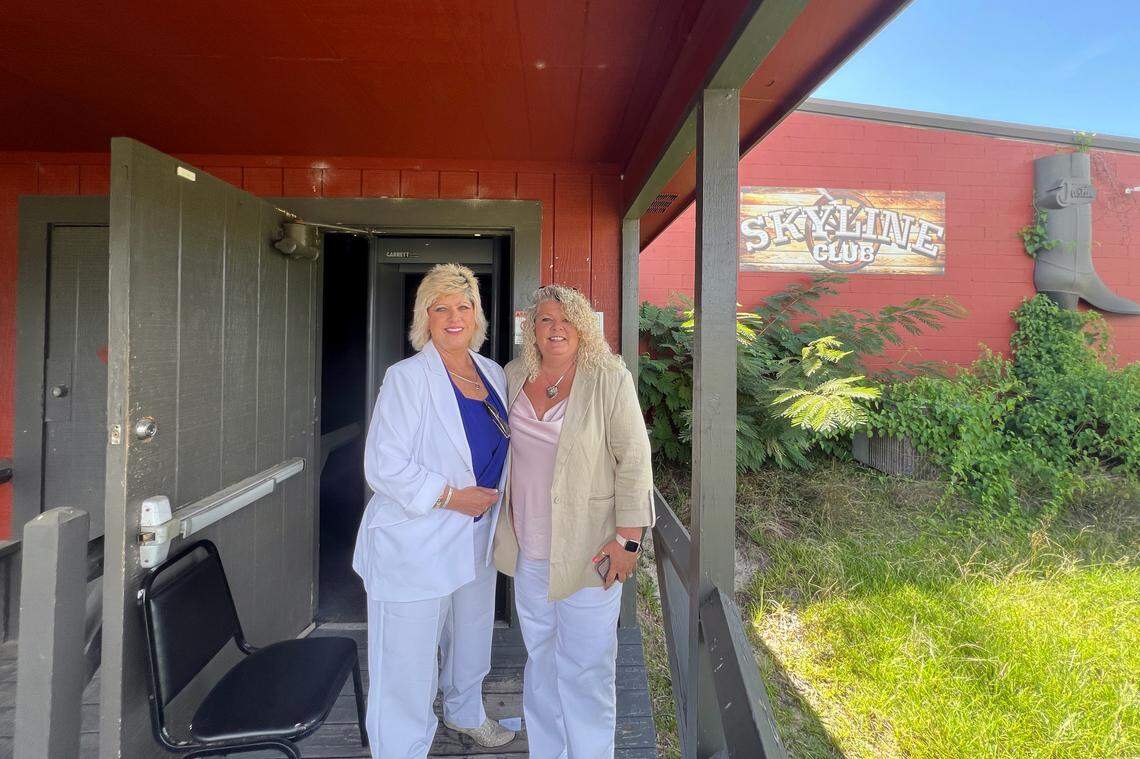 New owner Angie Cook and a friend pose outside of Skyline Club. Cook entered the historic venue as owner for the first time on July 16, 2025.