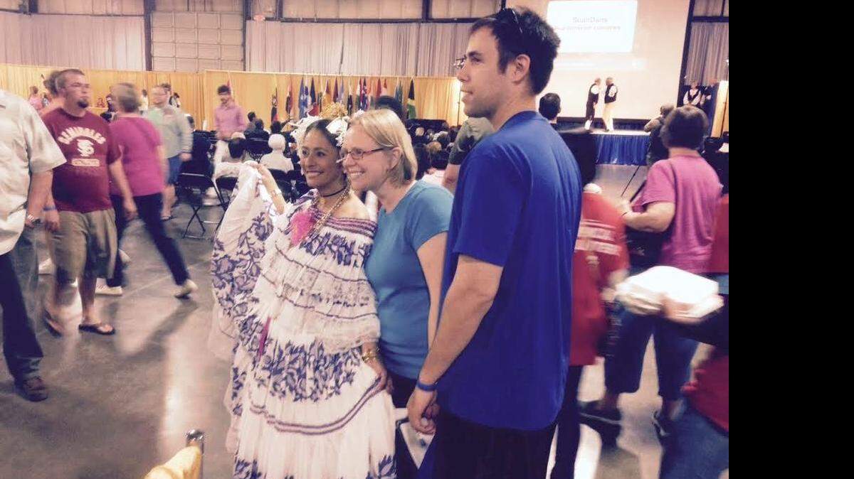 
Guests pose for pictures with presenters wearing native clothing during Saturday’s Columbia International Festival.
