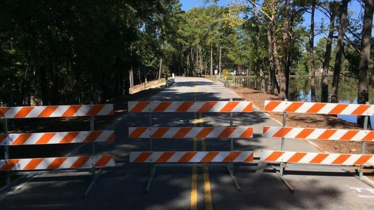 Barricades block Chatsworth Road across the Windsor Lake dam in northeast Richland County