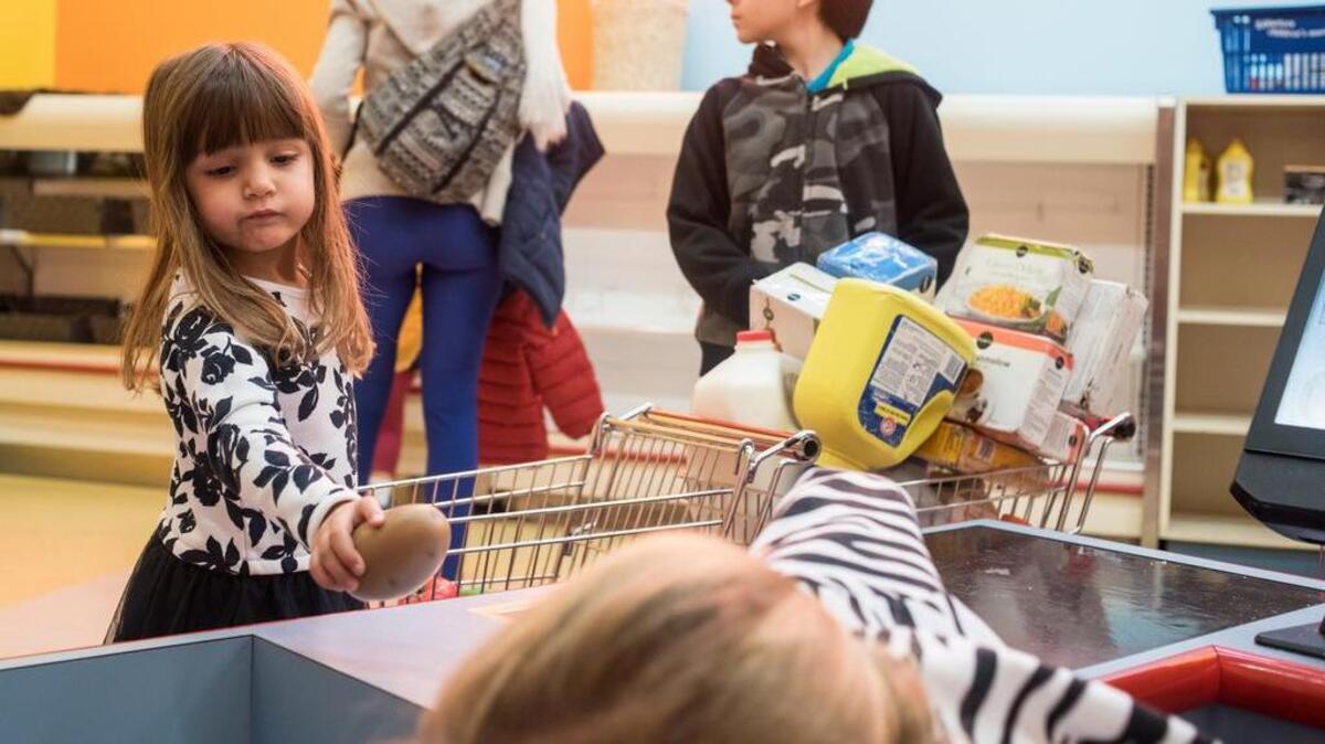 FILE PHOTO: In this December 31, 2016 photograph, Olivia Goldberg purchases a potato at the mock Publix grocery store inside of EdVenture in Columbia.