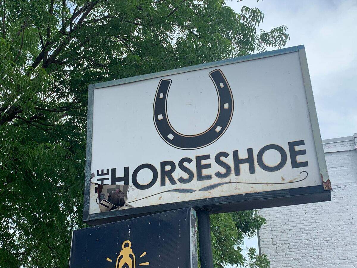 At least two pigeons have made a home in the broken sign for the old Horseshoe bar. The property is being converted into a restaurant.