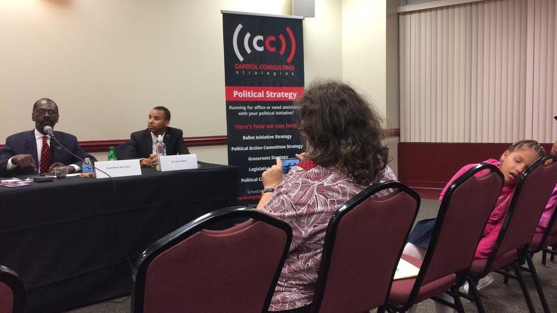 Karesse Bolden, 9, just can’t stay awake during a candidate forum Monday in North Columbia. Councilman Sam Davis, left, and challenger Chris Sullivan are among the four candidates seeking two seats of Columbia City Council.
