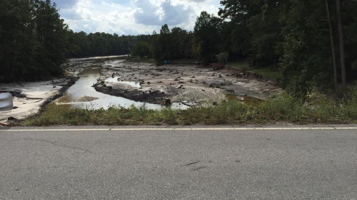 A road runs across the Windsor Lake dam in northeast Richland County.