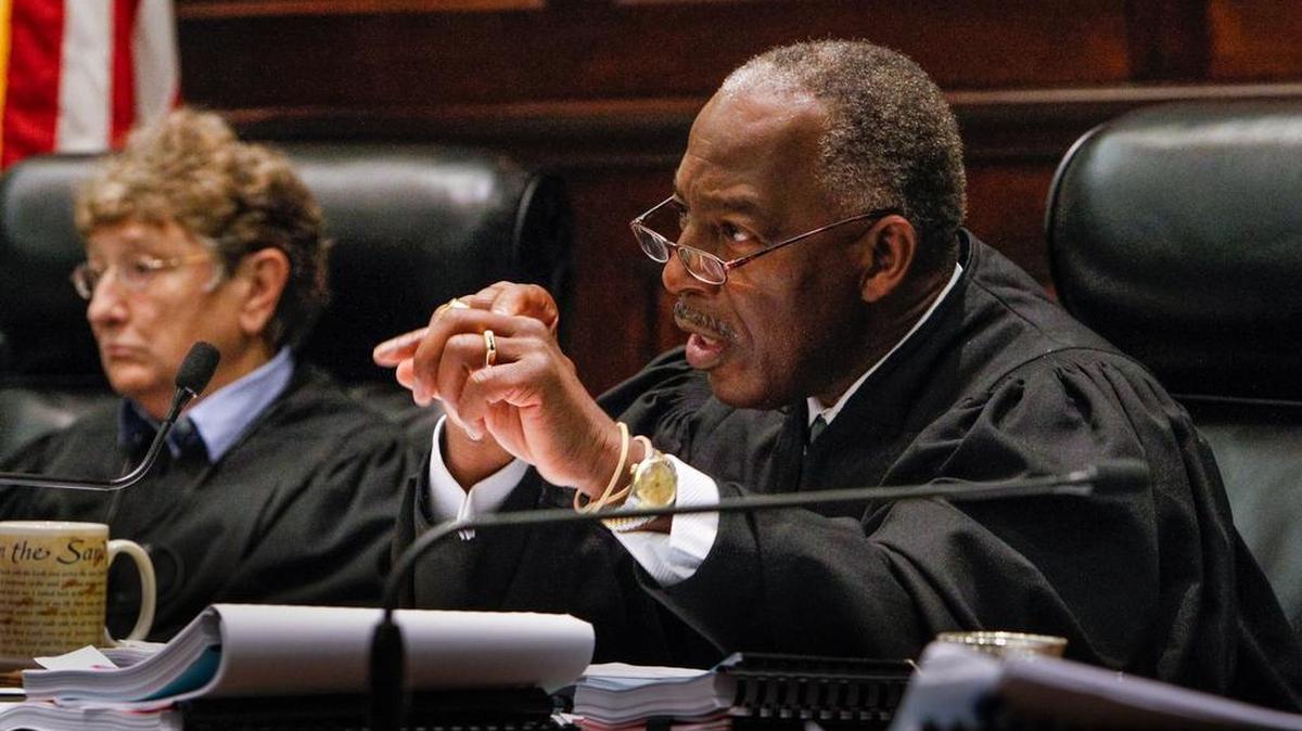 Justice Donald Beatty questions the lawyers representing eight South Carolina school districts who went before the state Supreme Court in 2012.