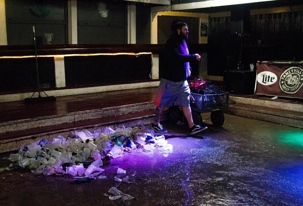 Plastic cups, beer cans, and puddles of alcohol are left after Friday After Class at Group Therapy.