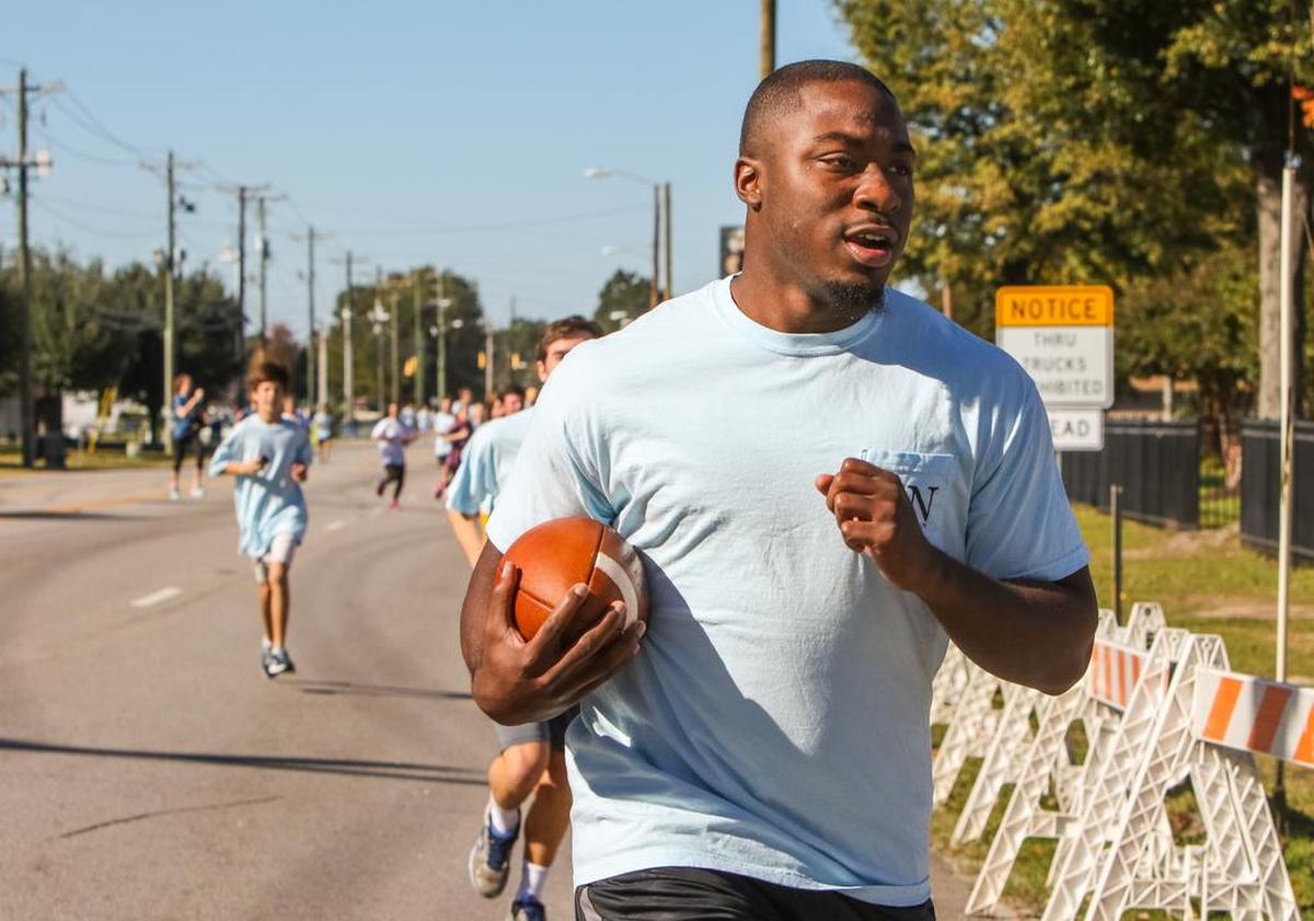 Marcus Lattimore runs the final leg of the annual Sigma Nu gameball run before the USC-Clemson game. The route came through Olympia to the George Rogers statue at Williams-Brice Stadium. Lattimore and South Carolina Interim head coach Sean Elliott ran the final legs from the Sigma Nu house at the Greek Village to the stadium.