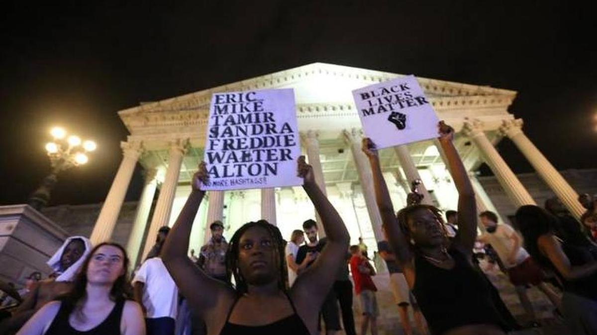 Black Lives Matter protesters rally at the SC State House late on July 10.