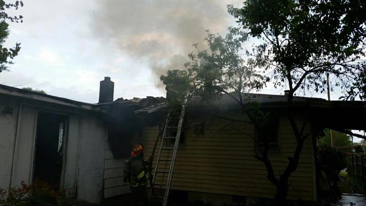 Officials say a 104-year-old woman escaped a Cayce house fire unharmed Tuesday.