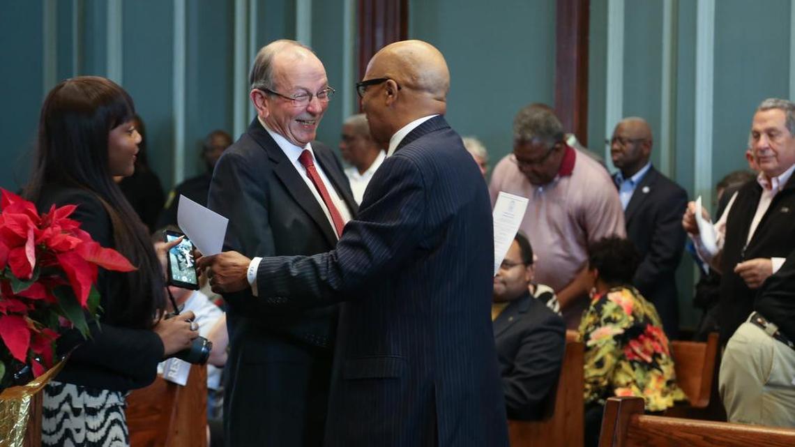 Howard Duvall and Edward McDowell greet each other before they were sworn in to serve on the City Council in 2015. The ceremony was held in the Columbia City Hall.