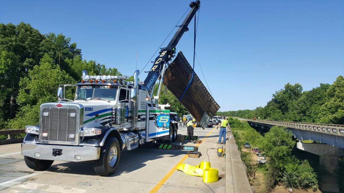 Crews remove part of a tractor trailer Sunday morning.