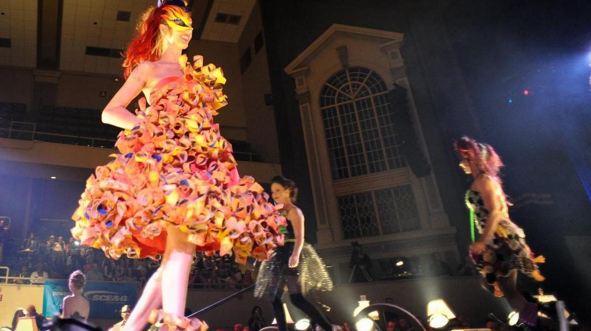 Models “strut their junk” during Runaway Runway, a fashion show featuring clothes made from recycled materials.