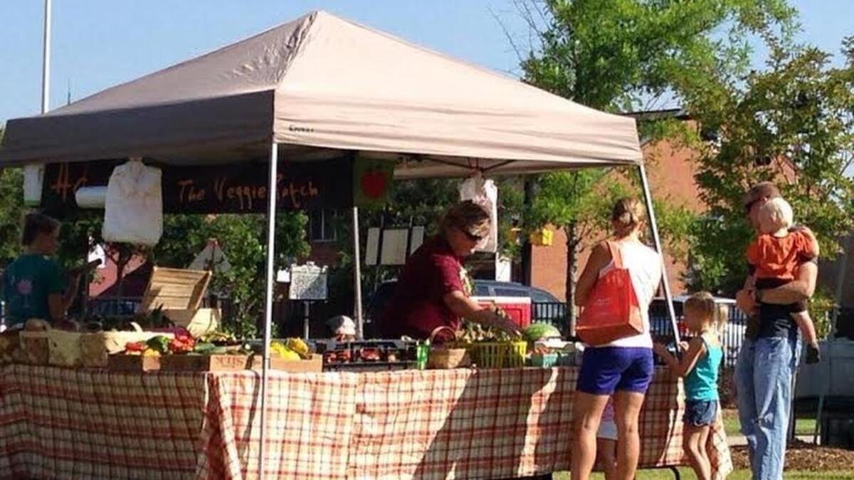 Fruits and vegetables are popular at the farmers market at Lexington Town Square Park.