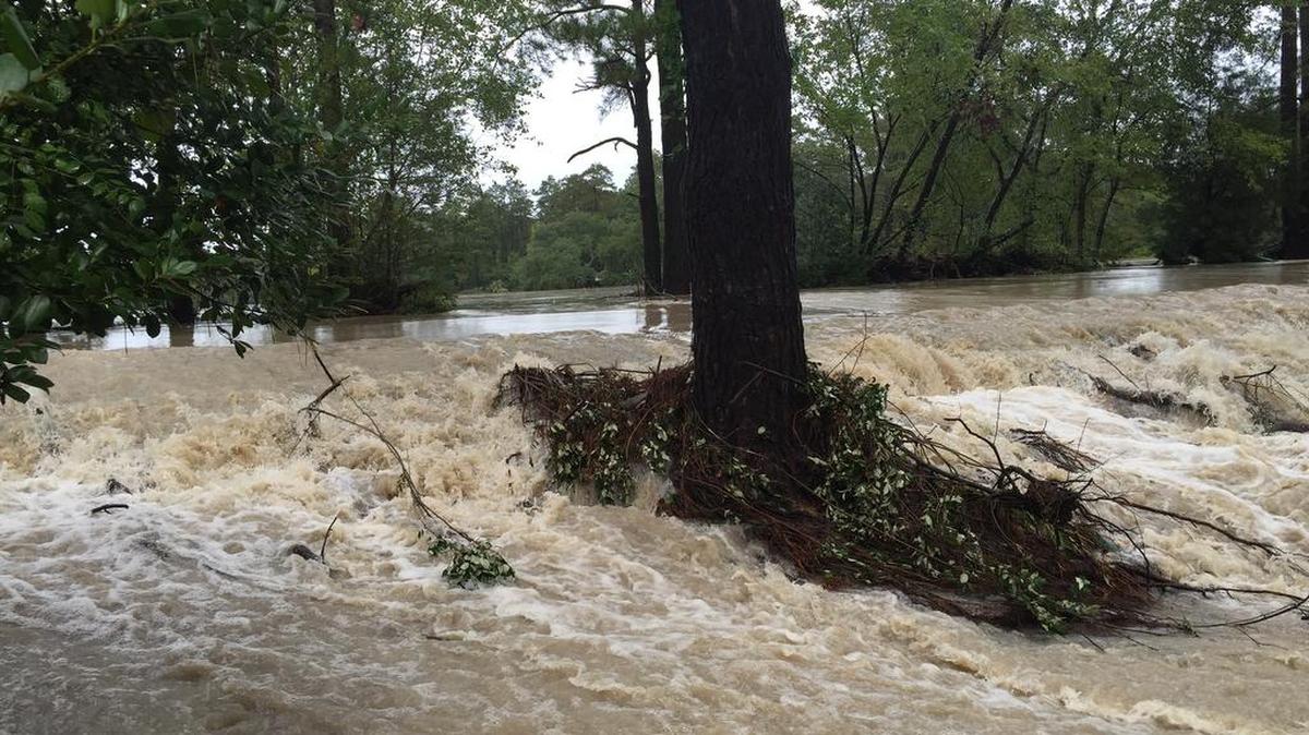 
Flood waters overtop Spring Lake dam Oct. 4 during historic rains in Columbia.
