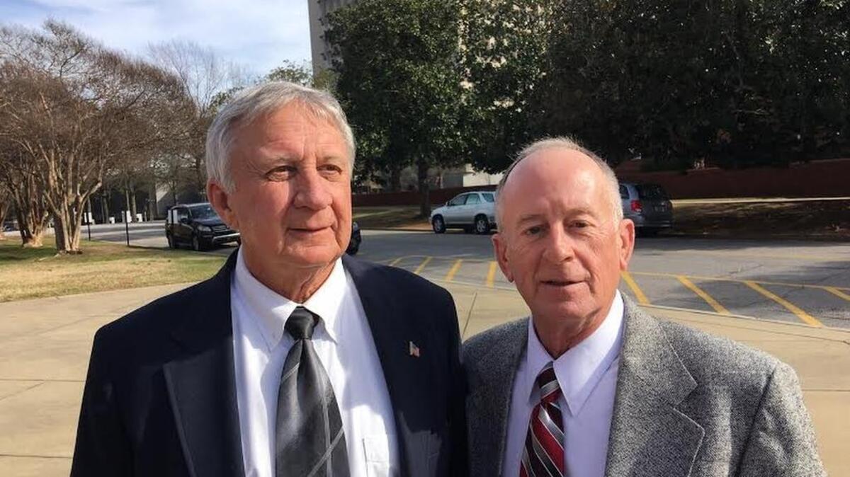 Jack Parker (left) and Doug Taylor outside the federal courthouse as their retrial on gambling charges started Monday.