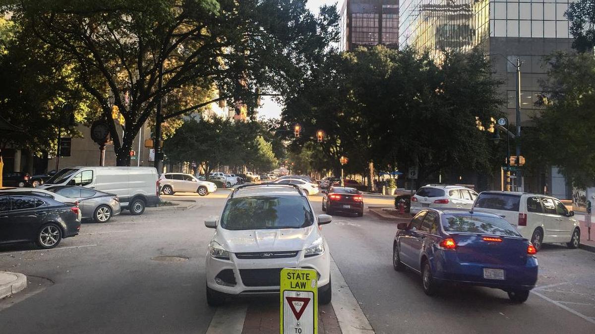 Cars often park in the median on Main Street, but technically, it’s illegal.