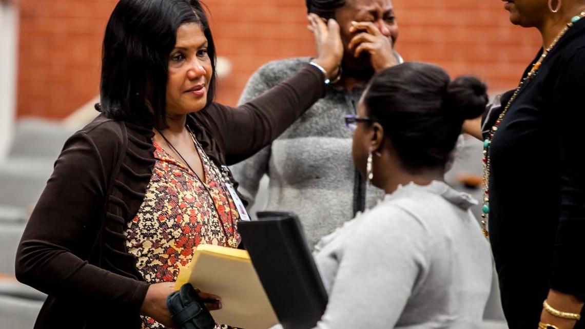 Then-Richland County elections director Lillian McBride, left, comforts supporters after she stepped down to a lesser position after the 2012 fiasco that left thousands in line for hours and prompted some not to vote.
